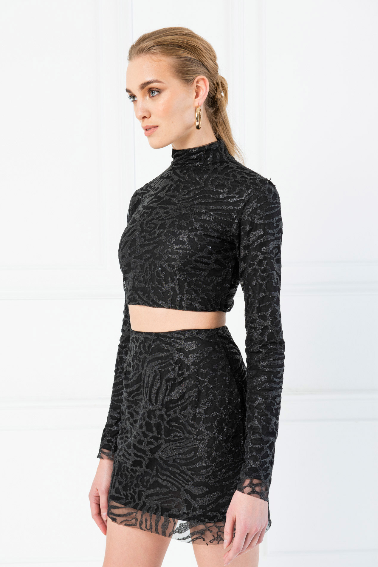 black sequin crop top and skirt